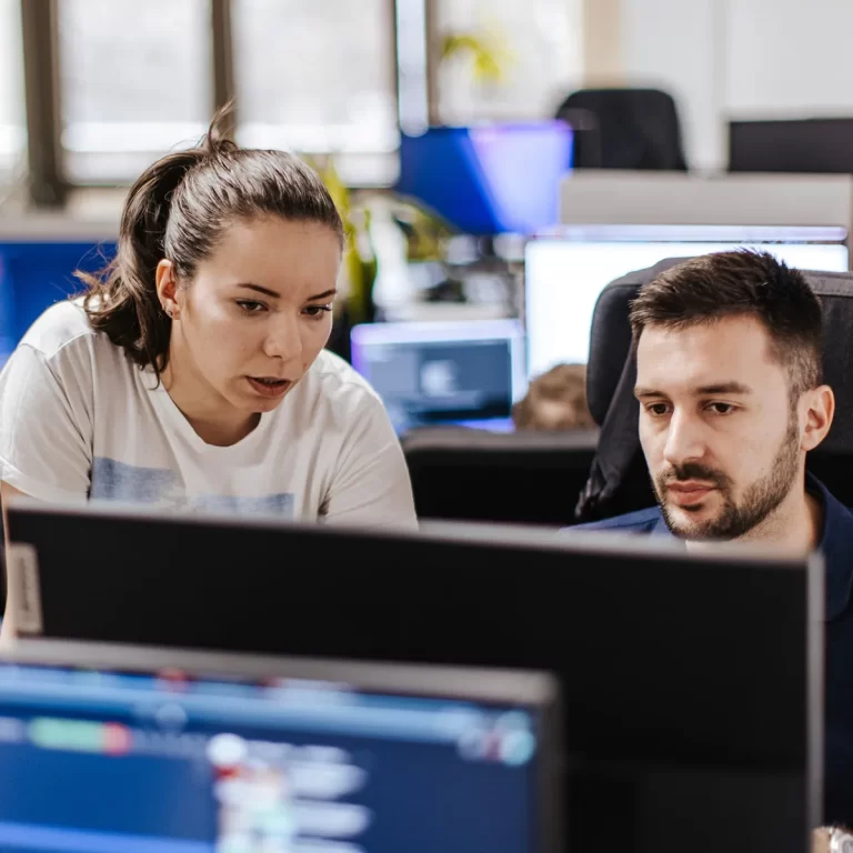 Office Workers Checking PC Screen